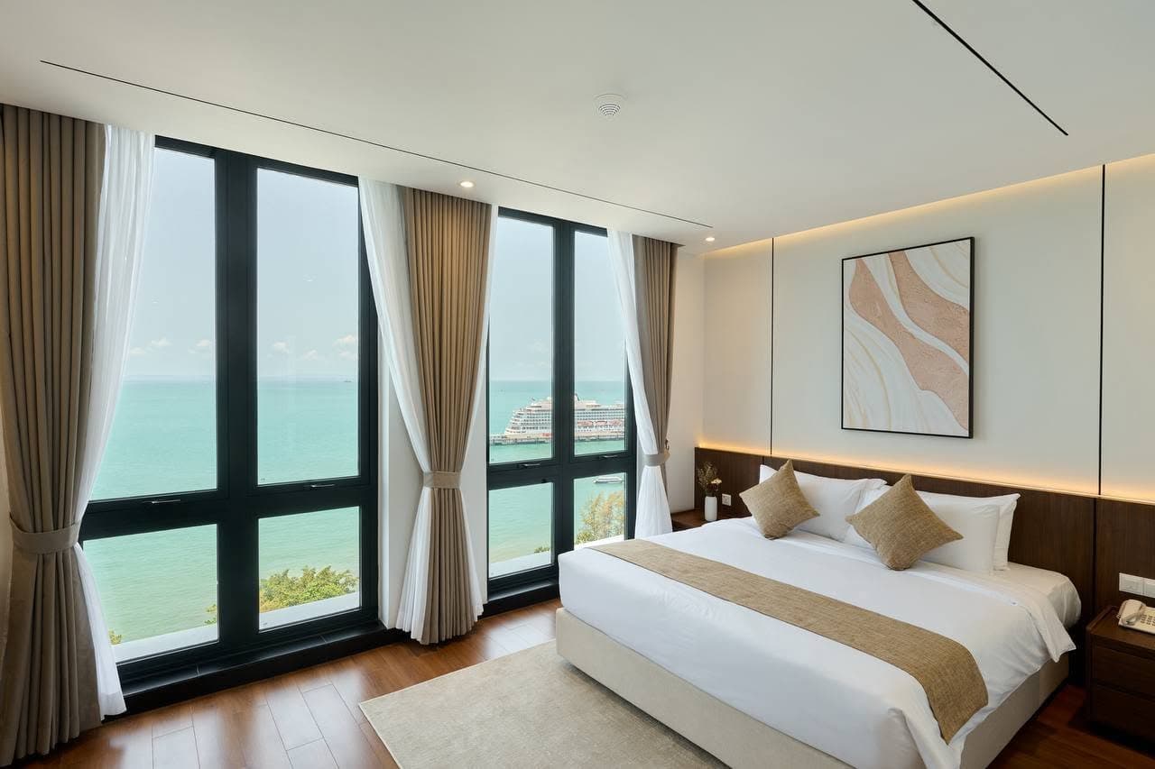 Bedroom with balcony windows